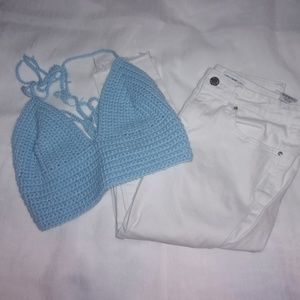This is a handmade crocheted baby blue crop-top.